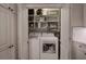 Bright, clean laundry area with shelving and washer/dryer units at 505 Bainbridge Dr, Atlanta, GA 30327