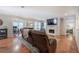 Spacious living room featuring hardwood floors, a fireplace, and open access to the office and bedroom at 505 Bainbridge Dr, Atlanta, GA 30327
