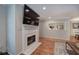 The living room features a fireplace, TV, and a view to the kitchen at 505 Bainbridge Dr, Atlanta, GA 30327