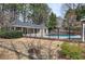 Private pool area with covered pavilion and black metal fence at 505 Bainbridge Dr, Atlanta, GA 30327