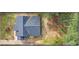 Aerial view of home with a large roof, backyard, and mature trees creating a private retreat at 1111 Edgefield Sw Dr, Atlanta, GA 30310