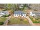 Aerial view showcases the home's well-maintained lawn, landscaping, and charming curb appeal at 1111 Edgefield Sw Dr, Atlanta, GA 30310