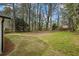 Spacious backyard featuring lush greenery and mature trees, perfect for outdoor enjoyment at 1111 Edgefield Sw Dr, Atlanta, GA 30310