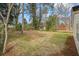 Spacious backyard featuring lush greenery and mature trees, perfect for outdoor enjoyment at 1111 Edgefield Sw Dr, Atlanta, GA 30310