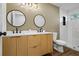 Modern bathroom features double vanity, stylish mirrors and tiled shower at 1111 Edgefield Sw Dr, Atlanta, GA 30310