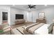 Spacious bedroom with TV, ceiling fan, modern decor, and an ensuite bathroom featuring a black shower at 1111 Edgefield Sw Dr, Atlanta, GA 30310