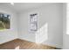 Bright bedroom featuring hardwood floors and natural light from updated double-pane windows at 1111 Edgefield Sw Dr, Atlanta, GA 30310