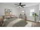 Stylish bedroom with a ceiling fan, tasteful decor, and lots of natural light from the window at 1111 Edgefield Sw Dr, Atlanta, GA 30310