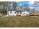 Charming home with white siding and a freshly manicured front lawn at 1111 Edgefield Sw Dr, Atlanta, GA 30310