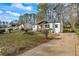 Well-maintained home with updated siding, landscaping, and a long driveway at 1111 Edgefield Sw Dr, Atlanta, GA 30310