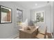 Bright home office with natural light, wood desk, and neutral decor, perfect for a productive workspace at 1111 Edgefield Sw Dr, Atlanta, GA 30310