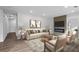 Bright living room featuring a fireplace, contemporary decor, and hardwood floors at 1111 Edgefield Sw Dr, Atlanta, GA 30310