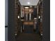 Organized walk-in closet with ample storage, lighting, drawers and shelving for clothing and accessories at 1111 Edgefield Sw Dr, Atlanta, GA 30310