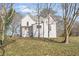 An expansive backyard with mature trees, partially shaded and ready for landscaping at 119 E Johnson St, Temple, GA 30179