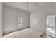 Bright bedroom features plank walls and vintage lighting, plus a window to the outside at 119 E Johnson St, Temple, GA 30179
