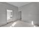 Bedroom with beadboard walls and abundant natural light, perfect for creating a peaceful retreat at 119 E Johnson St, Temple, GA 30179