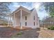 The house boasts a large porch area, and a two-story exterior that is painted bright white at 119 E Johnson St, Temple, GA 30179