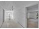 Hallway featuring bright white walls and ceiling, showing access to multiple rooms at 119 E Johnson St, Temple, GA 30179