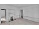 Spacious living room with fireplace and plank walls and doorways to the rest of the home at 119 E Johnson St, Temple, GA 30179