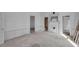 Spacious living room with fireplace and plank walls and doorways to the rest of the home at 119 E Johnson St, Temple, GA 30179