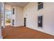 Spacious side porch with stained wood floors and columns, perfect for outdoor entertaining at 119 E Johnson St, Temple, GA 30179