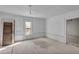 Bright room features a window and paneled walls, plus a vintage door at 119 E Johnson St, Temple, GA 30179