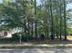 Street view of the lot and signage for sale shows the ample space for building your dream home at 120 Woodlawn Drive, Marietta, GA 30067