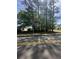 Street view of the vacant lot showing the available space and neighborhood setting at 120 Woodlawn Drive, Marietta, GA 30067
