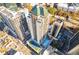 A stunning aerial view of a modern high-rise apartment building, showcasing its pool, tennis court, and prime location at 1280 W Peachtree Nw St # 2201, Atlanta, GA 30309