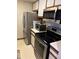 Functional kitchen with stainless steel appliances, and white countertops at 1280 W Peachtree Nw St # 2201, Atlanta, GA 30309