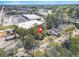 This aerial view shows the home in a densely populated suburban neighborhood with many trees at 240 Lamon Se Ave, Atlanta, GA 30316