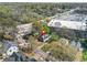This aerial view shows the home in a densely populated suburban neighborhood with many trees at 240 Lamon Se Ave, Atlanta, GA 30316