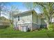 The backyard has a small basement door as well as chairs and a storage container at 240 Lamon Se Ave, Atlanta, GA 30316