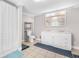 Bathroom features a toilet, double sink vanity, and shower with tile flooring at 240 Lamon Se Ave, Atlanta, GA 30316