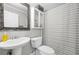 This bathroom features a vessel sink, a decorative mirror, and a black and white striped shower curtain at 240 Lamon Se Ave, Atlanta, GA 30316