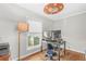 This bedroom features hardwood floors and an unusual ceiling fan with a circular light fixture at 240 Lamon Se Ave, Atlanta, GA 30316