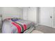 Bedroom featuring plush carpet, two doors, and a sports themed comforter set at 240 Lamon Se Ave, Atlanta, GA 30316