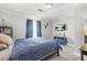 Bedroom with a blue comforter, TV, and natural light at 240 Lamon Se Ave, Atlanta, GA 30316