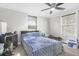 Bedroom with neutral paint and carpet, ceiling fan, and two windows at 240 Lamon Se Ave, Atlanta, GA 30316