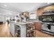 Spacious kitchen features stainless appliances, wooden cabinetry and an island with granite counters at 240 Lamon Se Ave, Atlanta, GA 30316