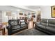 Open concept living area with hardwood floors, two couches, and views of the kitchen and dining room at 240 Lamon Se Ave, Atlanta, GA 30316