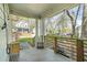 View of the front porch with wooden railings, string lights, and seating area at 240 Lamon Se Ave, Atlanta, GA 30316