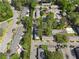 Aerial view showcases mature trees, manicured landscaping, and a community pool within the neighborhood at 3326 Northcrest Rd # C, Atlanta, GA 30340