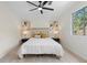 Bedroom featuring neutral walls, carpet, ceiling fan, and natural light from the large window at 3326 Northcrest Rd # C, Atlanta, GA 30340
