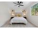 Bedroom featuring neutral walls, carpet, ceiling fan, and natural light from the large window at 3326 Northcrest Rd # C, Atlanta, GA 30340