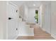 Inviting foyer with hardwood floors and a staircase leading to the upper level at 3326 Northcrest Rd # C, Atlanta, GA 30340