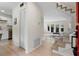 Bright entryway with hardwood floors, leading to the living area and staircase at 3326 Northcrest Rd # C, Atlanta, GA 30340