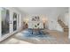 Bright living room with French doors, hardwood floors, and stylish decor at 3326 Northcrest Rd # C, Atlanta, GA 30340