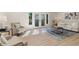 Spacious living room with hardwood floors and French doors leading to the patio at 3326 Northcrest Rd # C, Atlanta, GA 30340