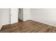 Empty bedroom with wood floors, white doors and neutral walls at 877 Pensive Run, Dacula, GA 30019
